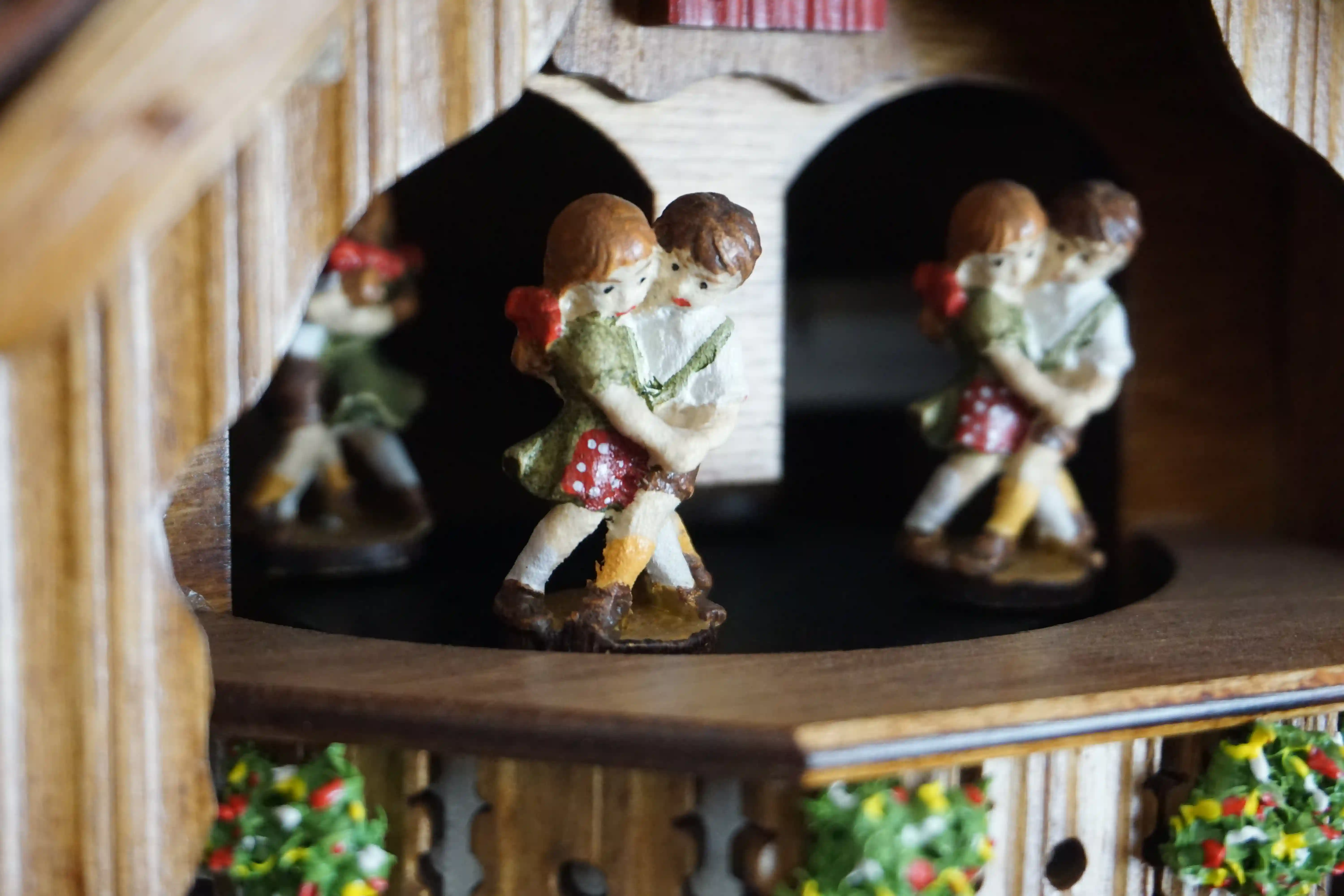 Cuckoo Clock  Kissing Kids with Music  1 Day Movement (6) Original black forest mechanical cuckoo clock carved to the finest detail, decorated with shingle roof, church tower bell, dancing and kissing kids and much more, plays music