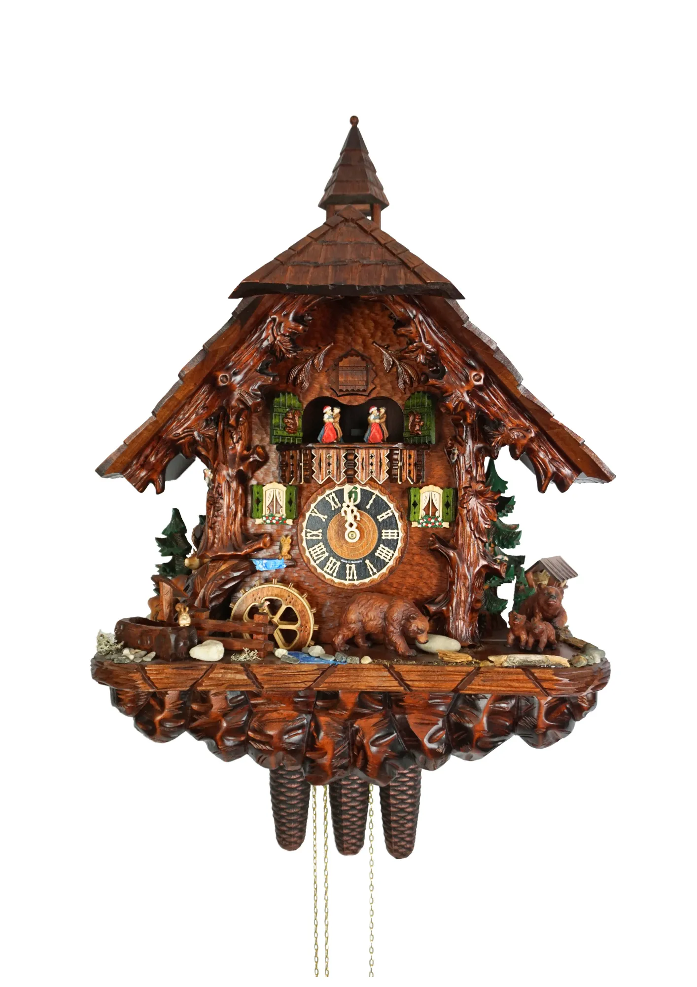 Massive hand carved mechanical 8 day brown cuckoo clock with absolute attention to detail. Clock is decorated with the black forest wildlife such as wood peckers, birds, squirels, deers and brown bears. Absolute stunning piece of art made by Hönes