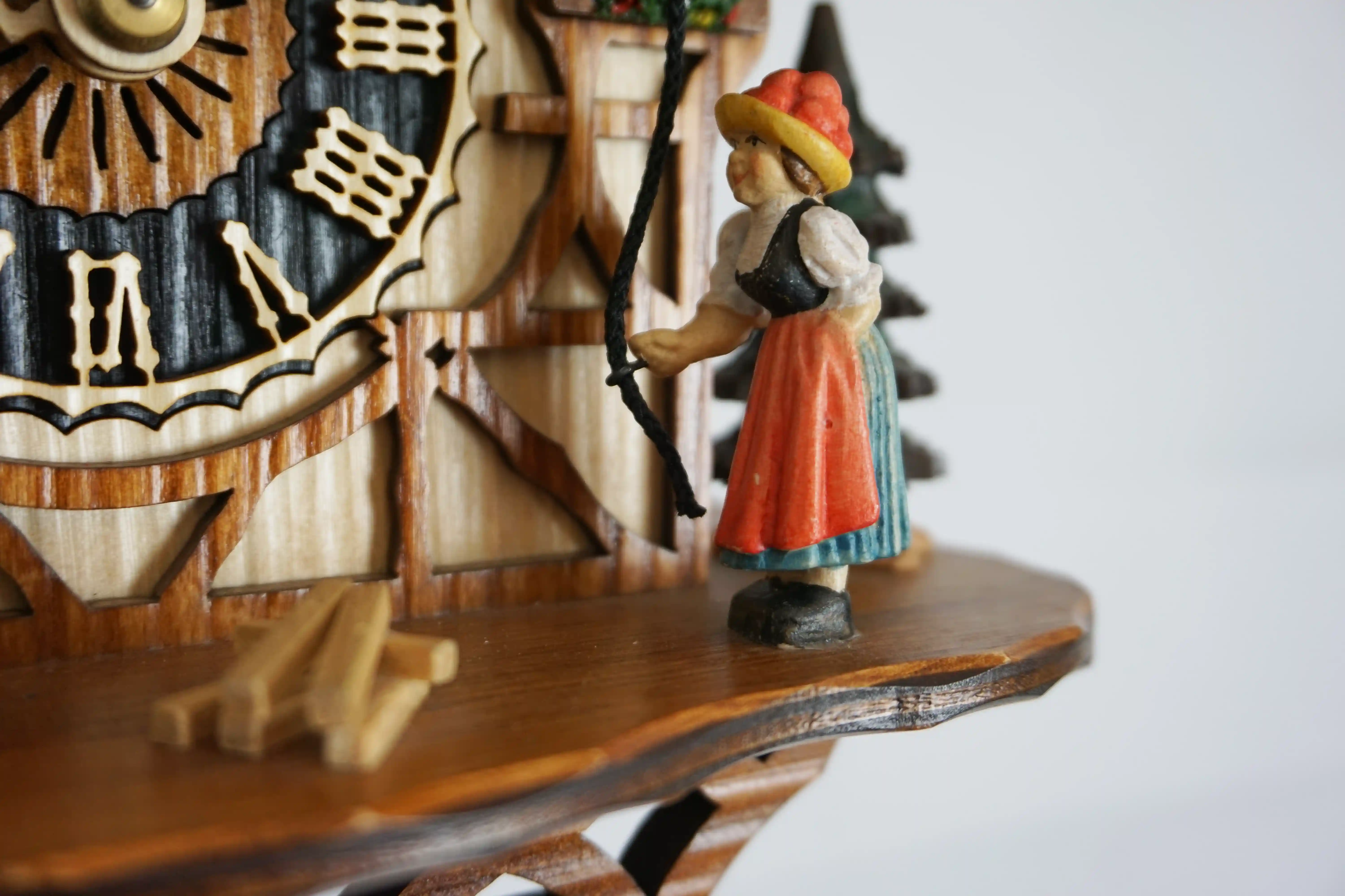 Cuckoo Clock  Bell Ringer  1 Day Movement (5) Chalet colorful authentic black forest cuckoo clock with a nice shingle roof and a lady wearing traditional black forest clothing and rings the bell every hour made by Hönes