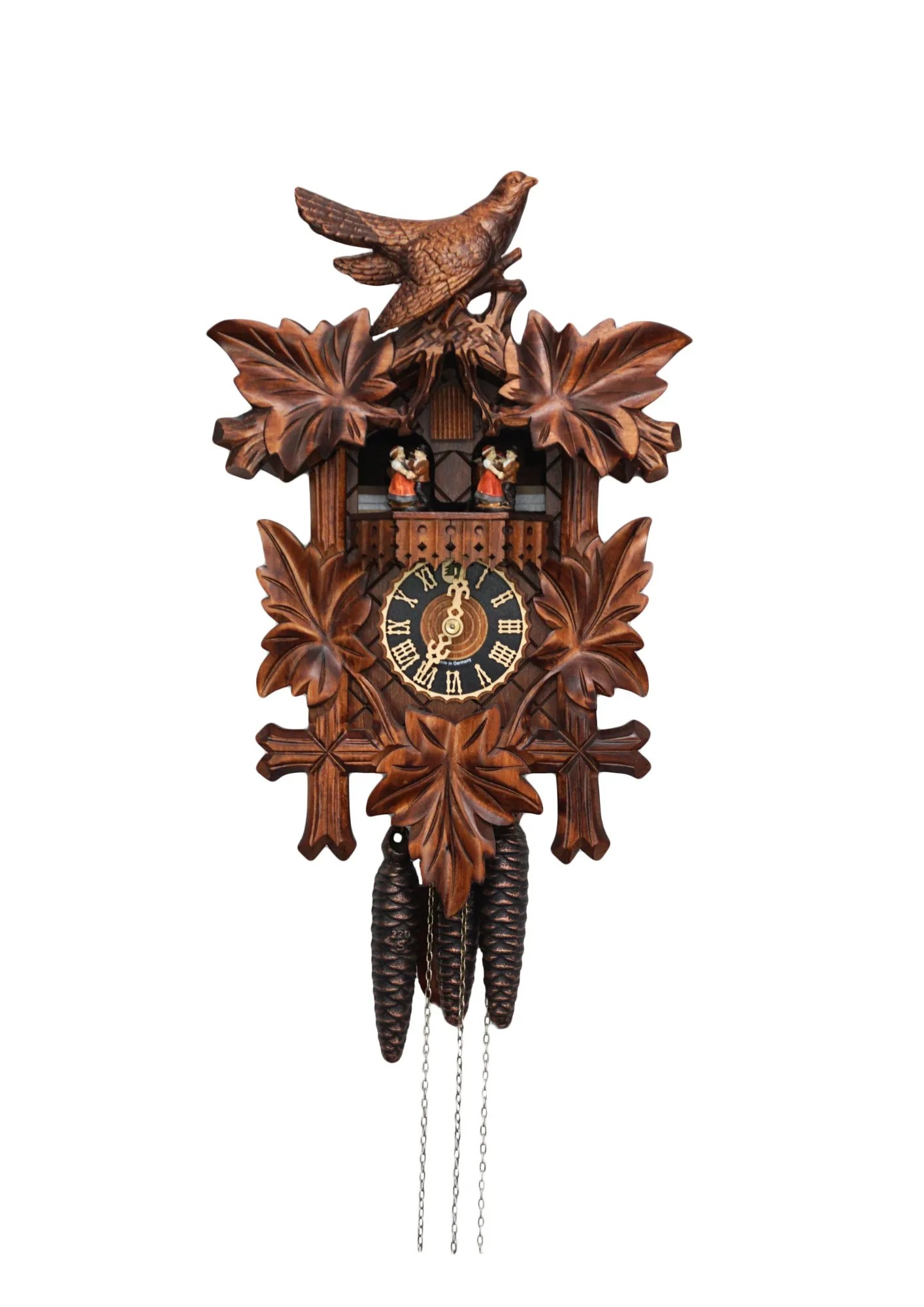 Cuckoo Clock  Traditional Style with Music  1 Day Movement   (1) Traditional stlye hard carved mechanical black forest cuckoo clock decorated with a carving of a cuckoo bird, plays music and has dancers made by Hönes