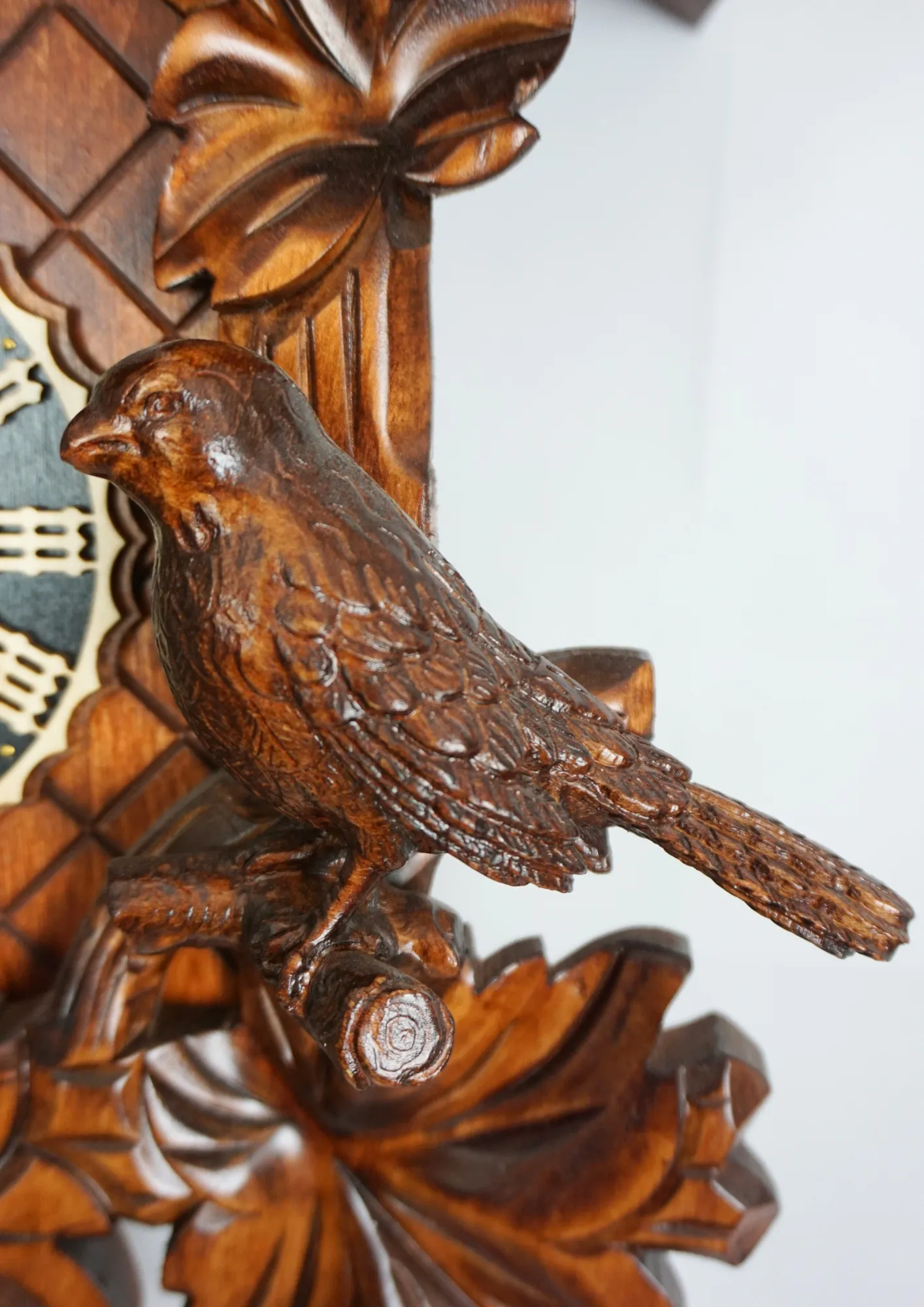 Cuckoo Clock  Traditional, Three Birds  8 Day Movement (3) Brown hand carved mechanical 8 days black forest cuckoo clock with three precisely carved cukoo birds, also covered in wine leaves, made by Hönes