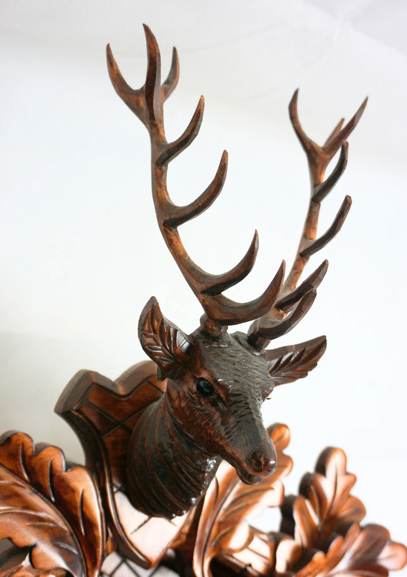 Cuckoo Clock  Hunter Clock  8 Day Movement (3) Hand carved authentic mechanical brown black forest cuckoo clock in a hunter theme. Precisely carved deer head is decorating the top while there is a hunter and a falcon figure on the sides of the clock. The clocks dial is wraped with a hunting horn while