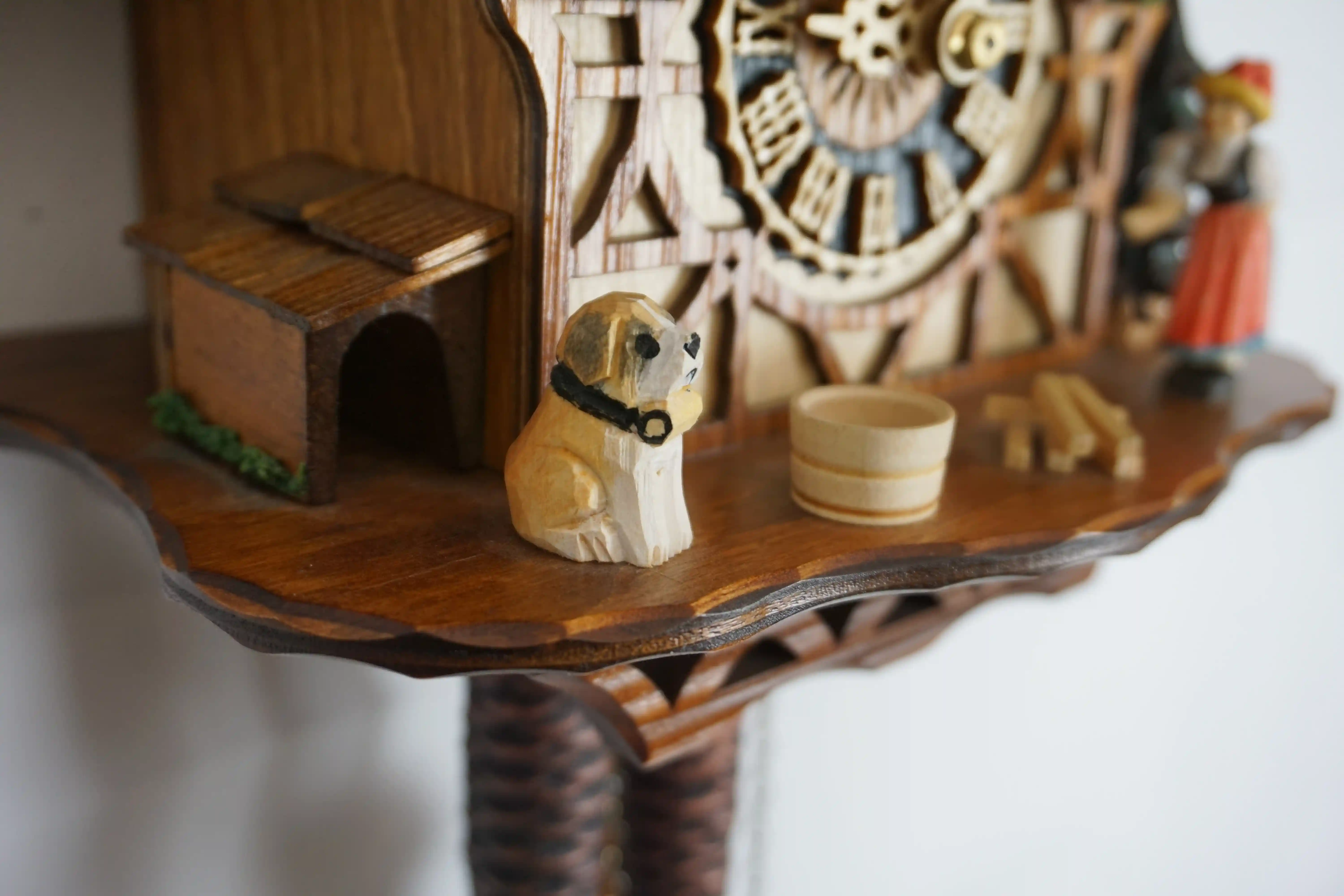 Cuckoo Clock  Bell Ringer  1 Day Movement (4) Chalet colorful authentic black forest cuckoo clock with a nice shingle roof and a lady wearing traditional black forest clothing and rings the bell every hour made by Hönes