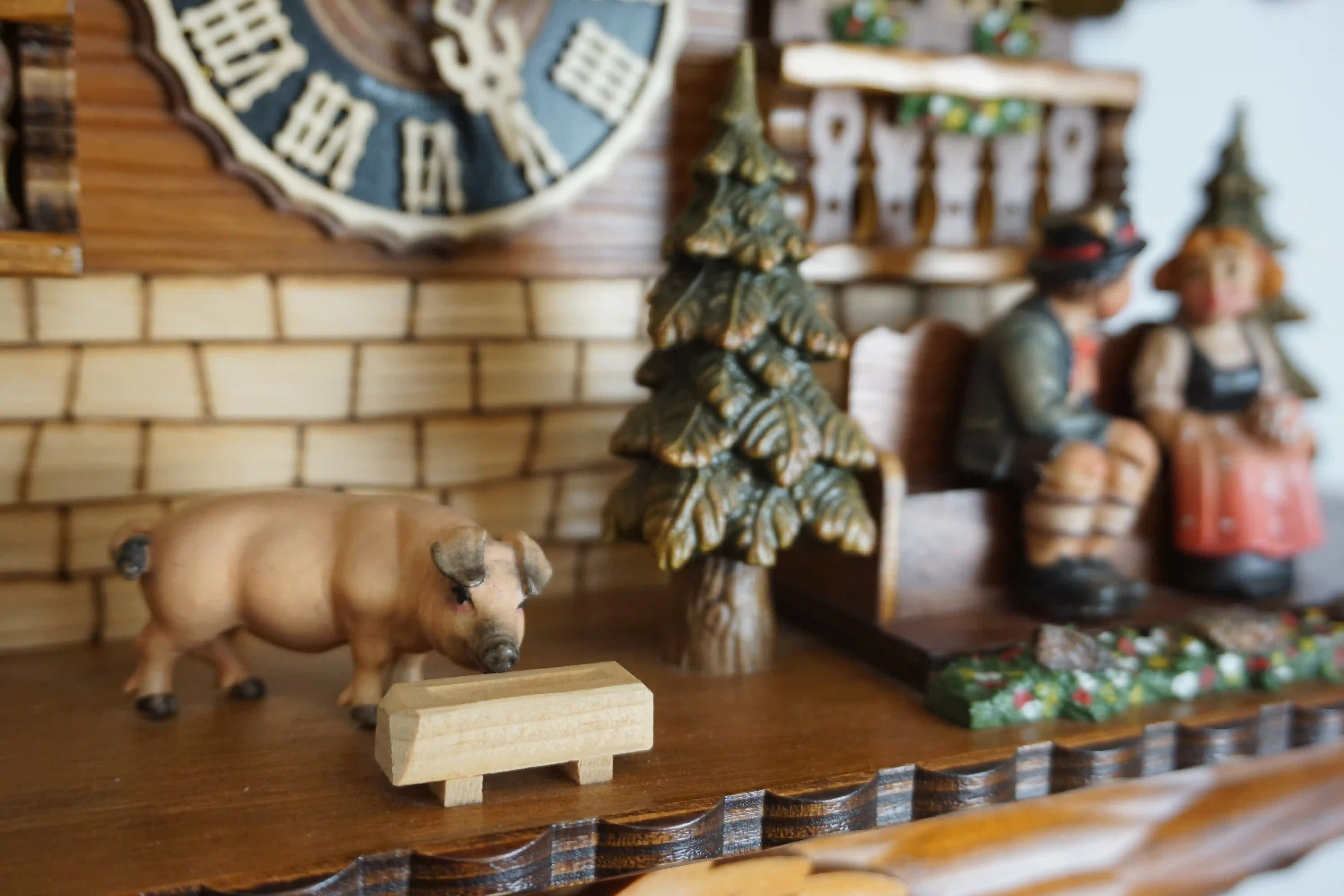 Cuckoo Clock  Honeymoon  8 Day Movement with Music (6) Large authentic chalet colorful black forest cuckoo clocks decorated to the finest detail. Represents a black forest couple on their honeymoon sitting on the bench in front of the shingle roof house. As the music plays the couple is kissing, water wheel t