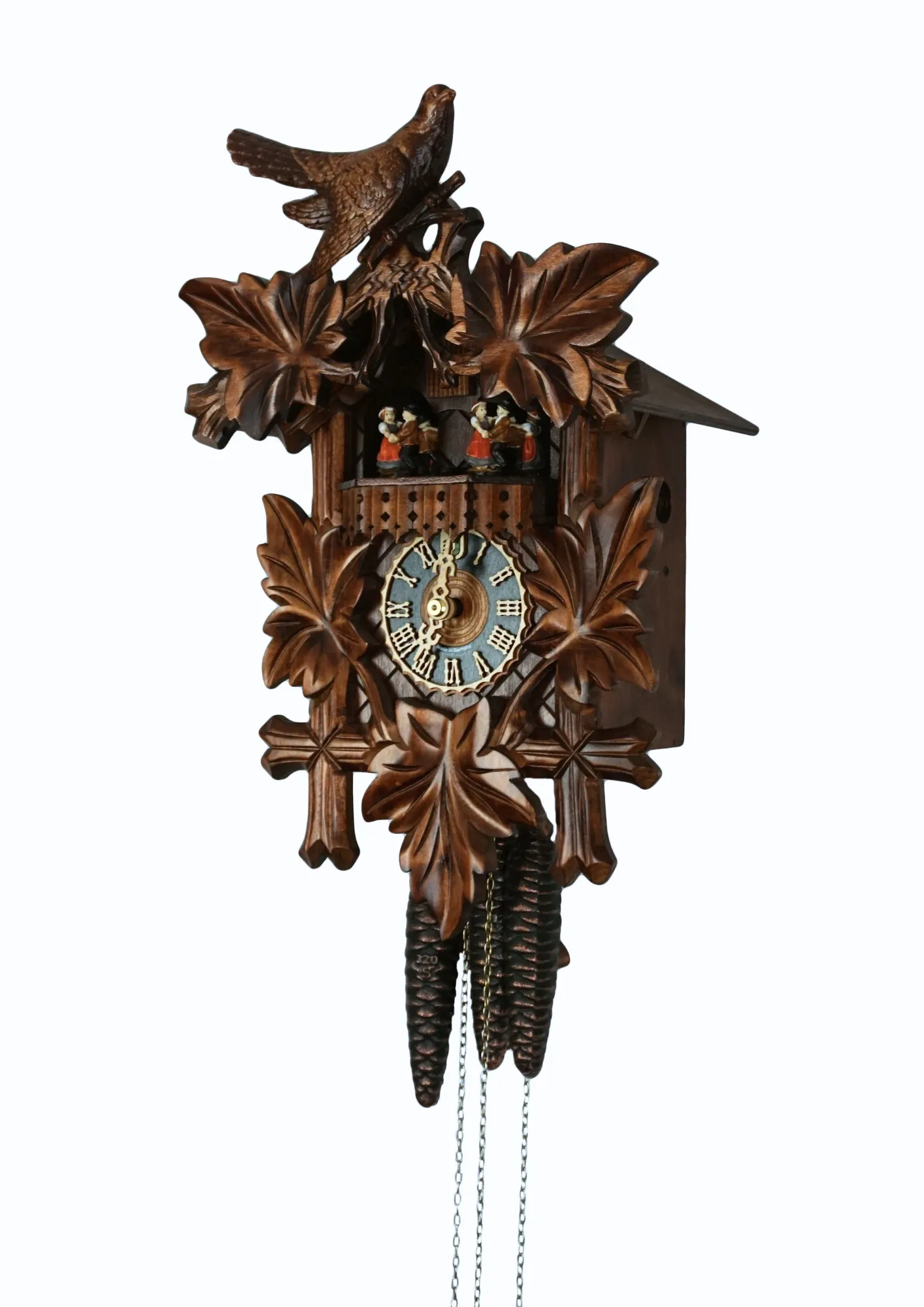 Cuckoo Clock  Traditional Style with Music  1 Day Movement   (2) Traditional stlye hard carved mechanical black forest cuckoo clock decorated with a carving of a cuckoo bird, plays music and has dancers made by Hönes