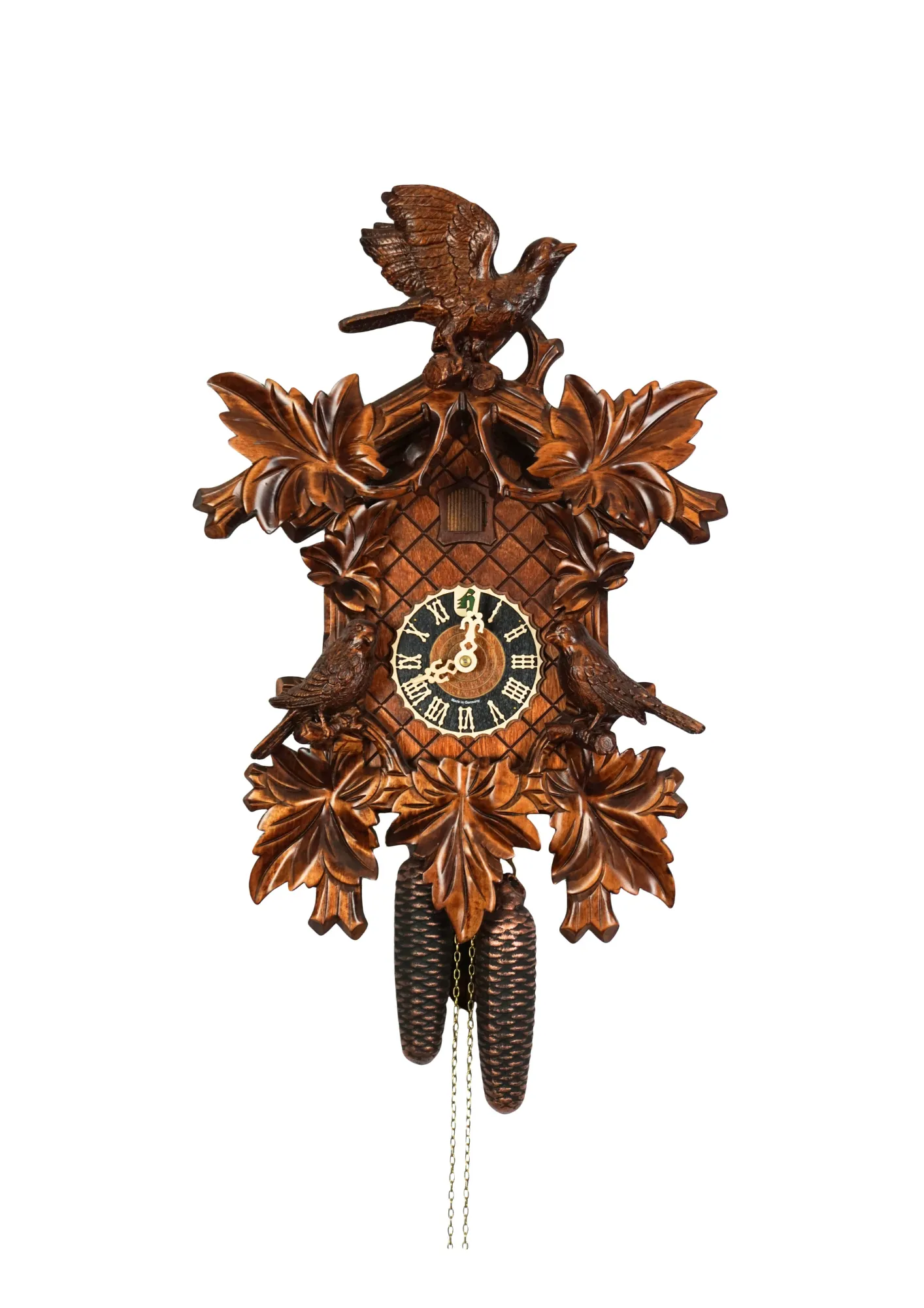 Brown hand carved mechanical 8 days black forest cuckoo clock with three precisely carved cukoo birds, also covered in wine leaves, made by Hönes