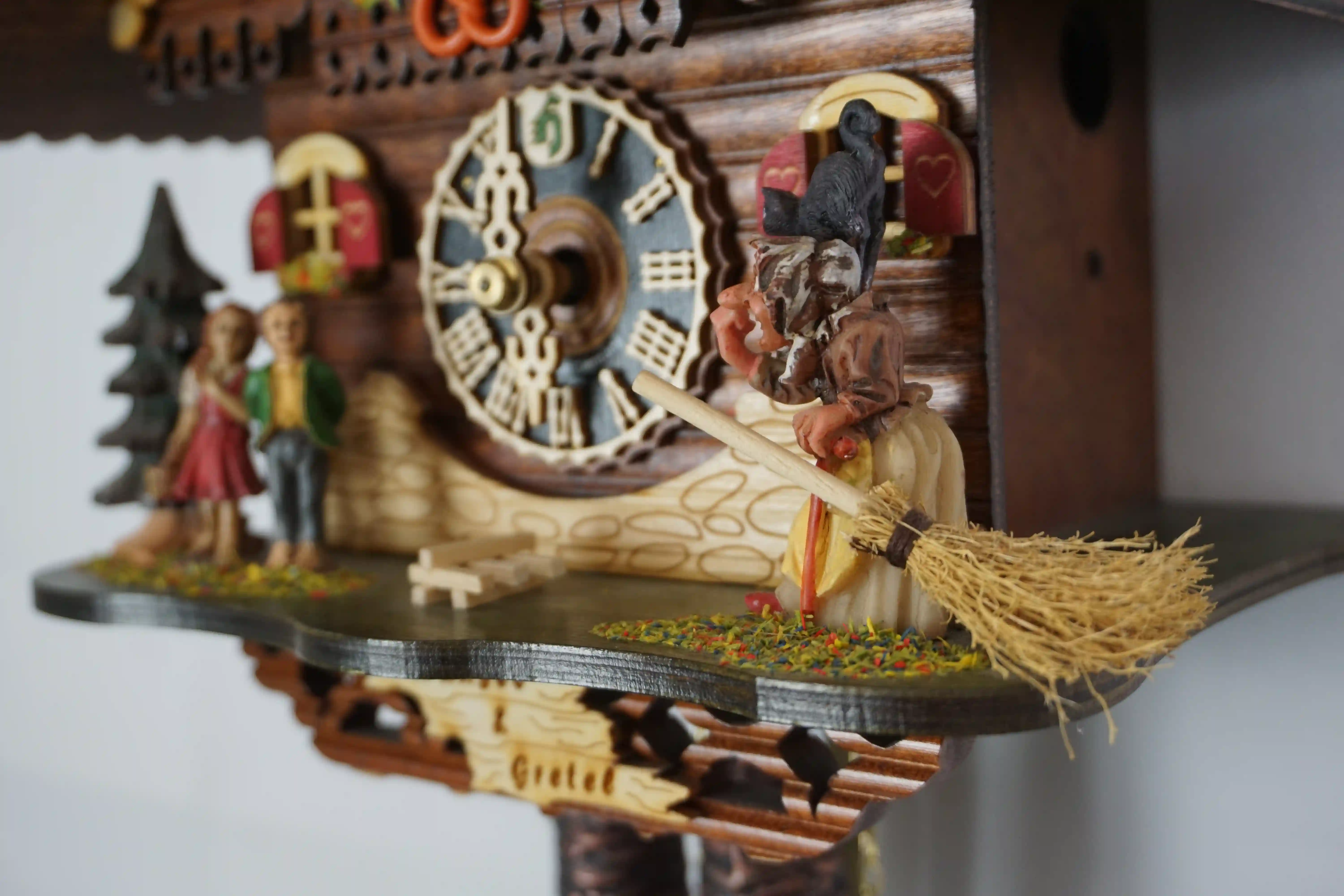 Cuckoo Clock  Hansel and Gretel  1 Day Movement (5) Authentic black forest cuckoo clock representing hansel and gretel story where the witch can be seen in front of the house of sweets made by Hönes
