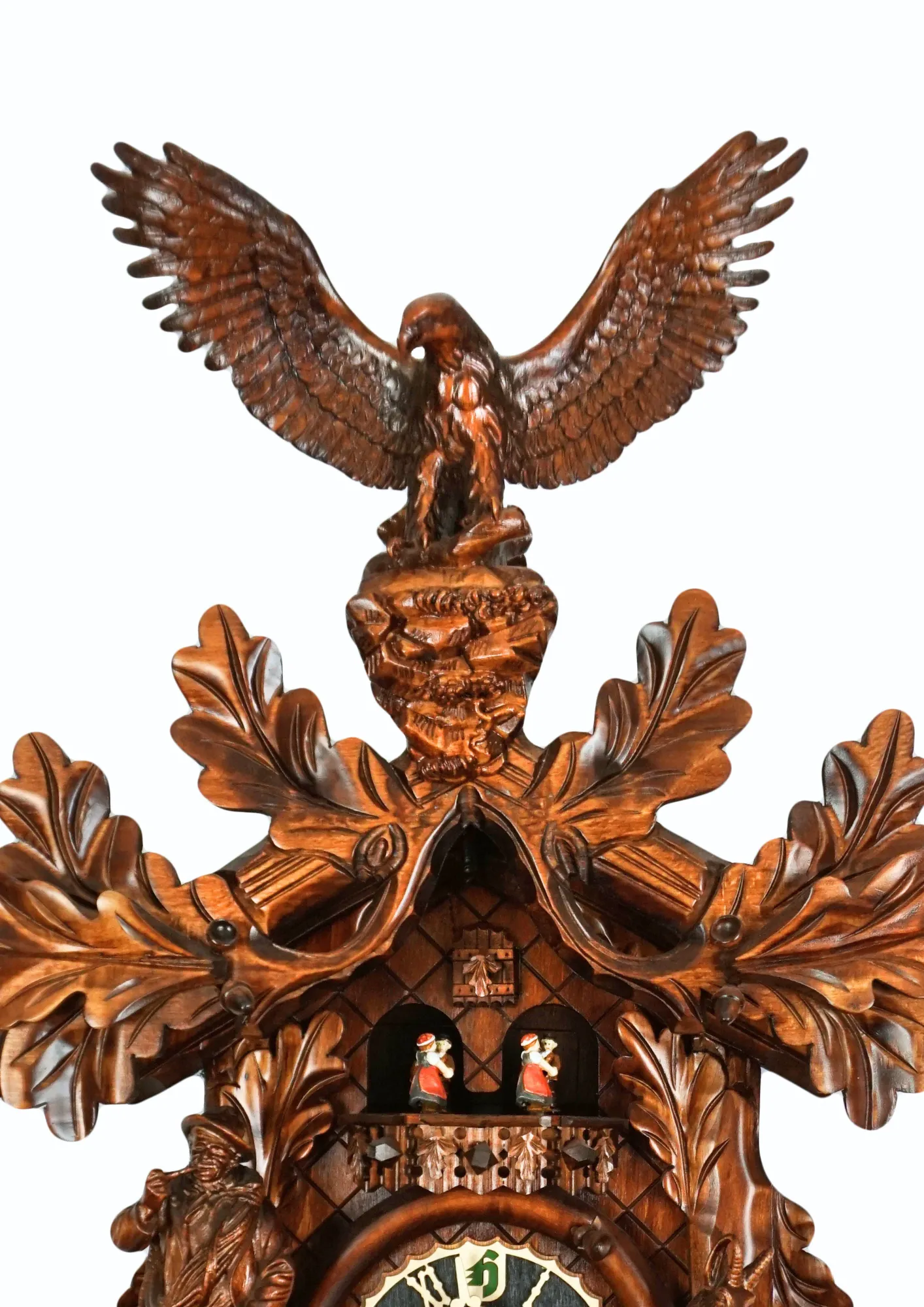 Cuckoo Clock  Majestic Eagle  8 Days Movement with Music (3) Precisely hand carved wildlife mechanical brown tradtional black forest clock, decorated with a majestic eagle, mountain goat and the rock climber. The clock plays music on the full hour and the dancers turn. This is one of the nicest tradtional cuckoo cl