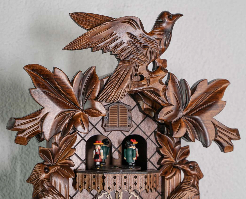 Cuckoo Clock  Traditional Style, Three Birds  Battery (5) traditional style carved cuckoo clock with ivy leaves and three birds decorating the clock, plays music and dancers turn made by Trenkle Uhren