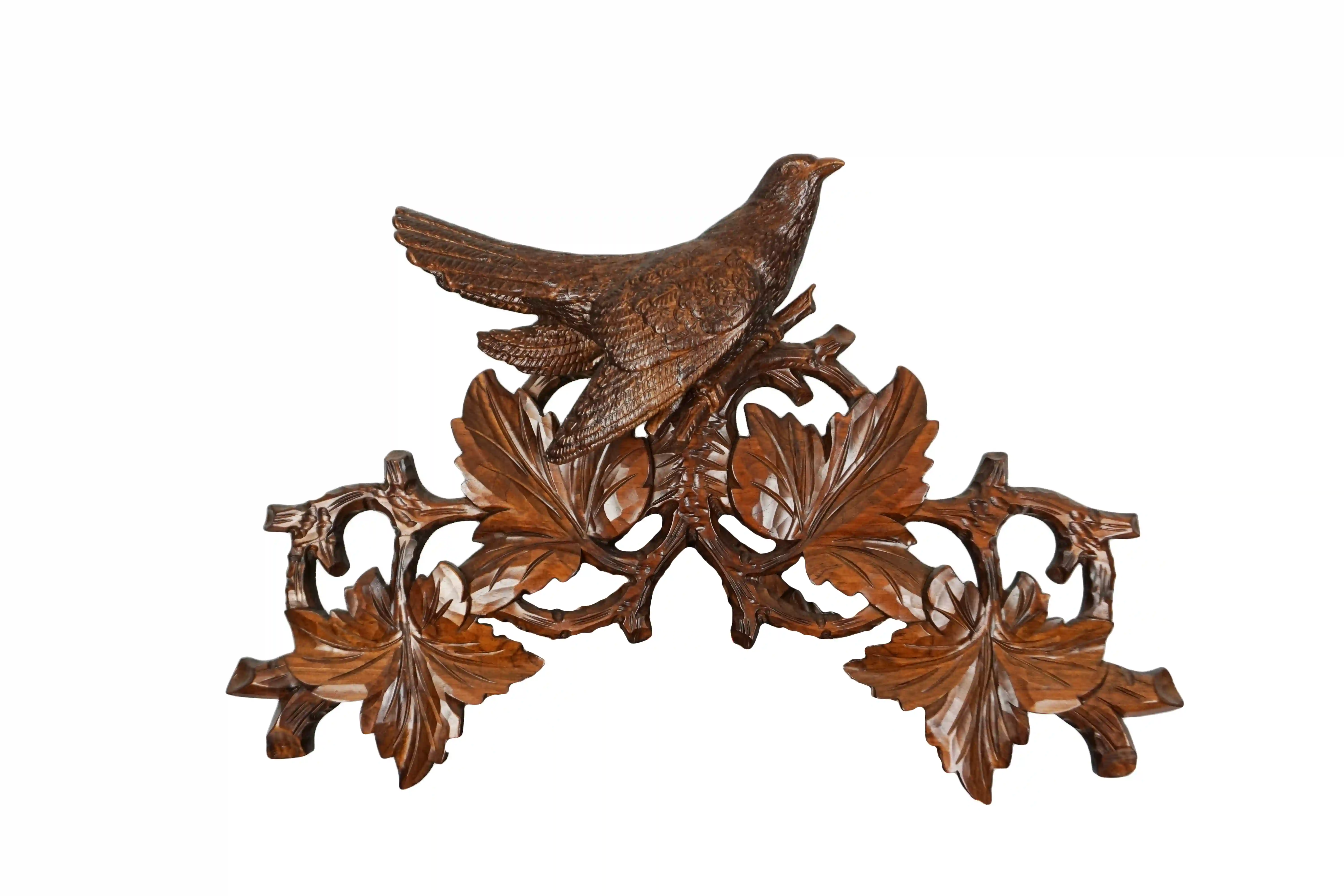 Cuckoo Clock  Birds Nest  8 Day Movement with Music (6) Authentic lager mechanical 8 day brown traditional black forest cuckoo clock hand carved to the finest detail. Decorated with five bird carvings and their nest with the offspring, this clocks represents the brid nest and wildlife in Black Forest. Made by