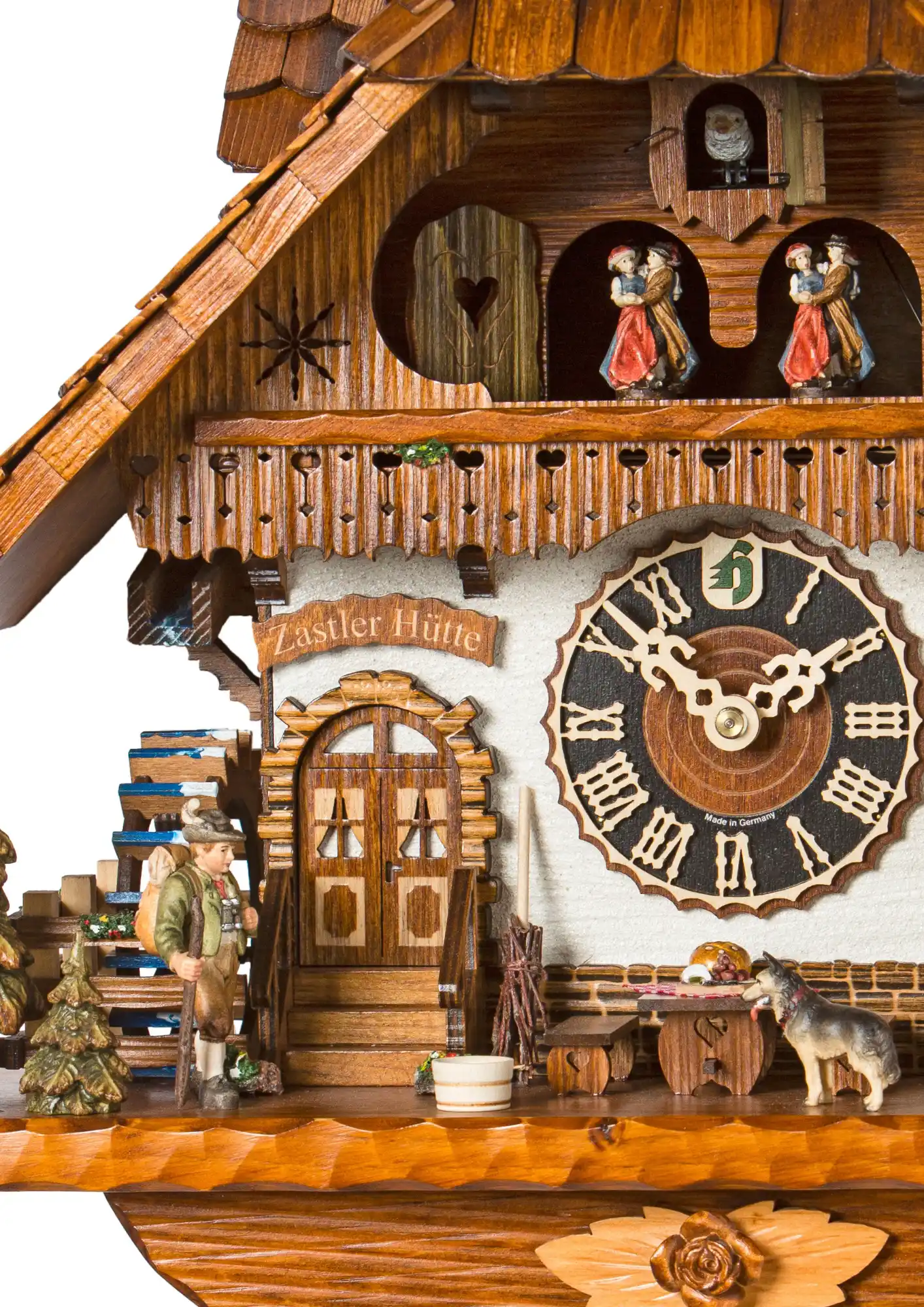 Cuckoo Clock Zastler Cottage 8 Day Movement with Music (3) Large chalet mechanical colorful black forest cuckoo clock decorated to the finest detail with wonderer, clock salesman and young lady figures. The lady wears traditional Black Forest dress with red bollenhut which means she is single. Dancers dance, wate