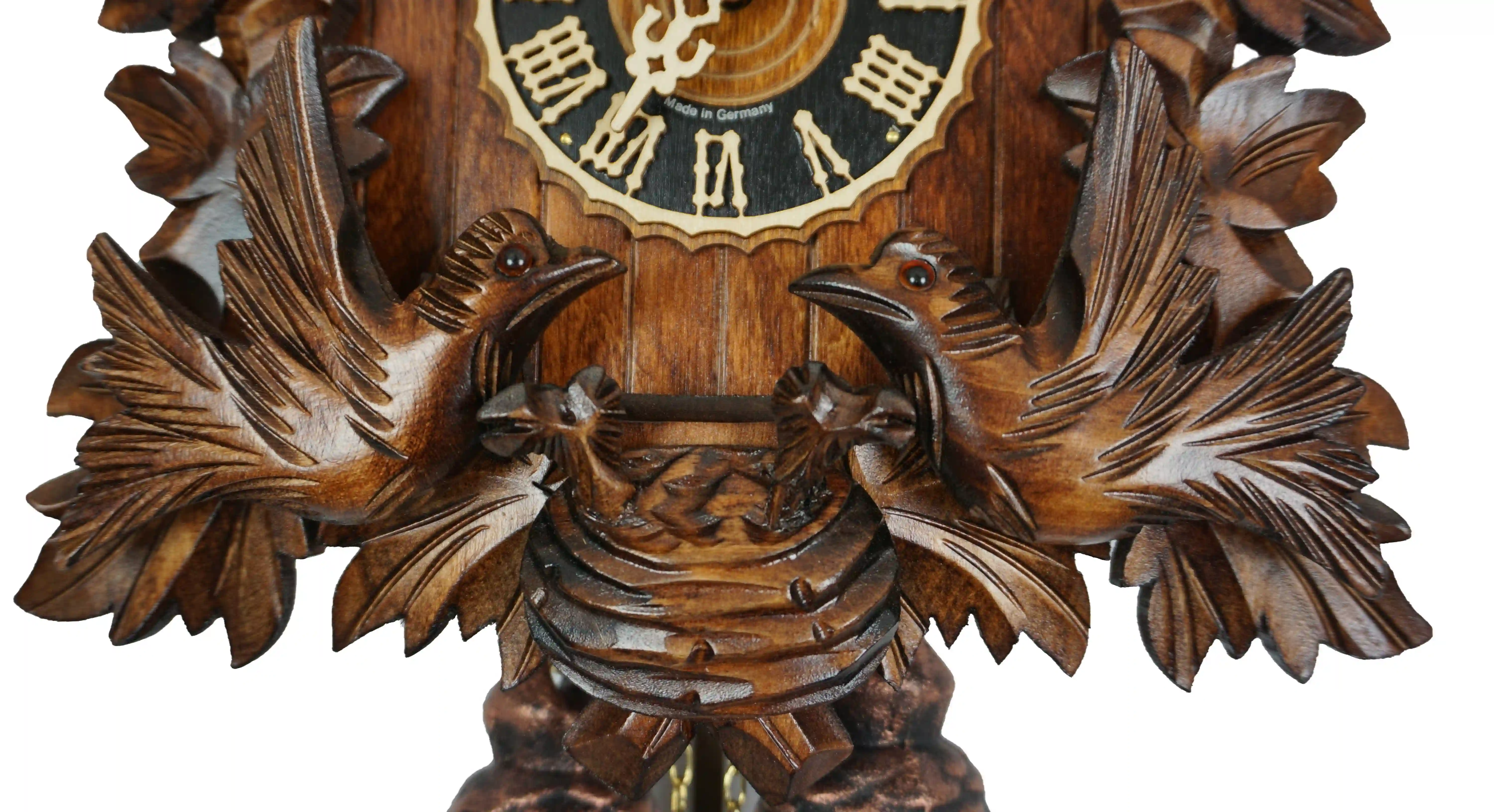 Cuckoo Clock  Moving Birds  8 Day Movement  (4) Hand carved mechanical 8 days black forest cuckoo clock with unusual design, while the frame is decorated in traditional style, the roof is covered in shingles. Two birds at the front are moving every time cuckoo comes out and feeding the offspring in the