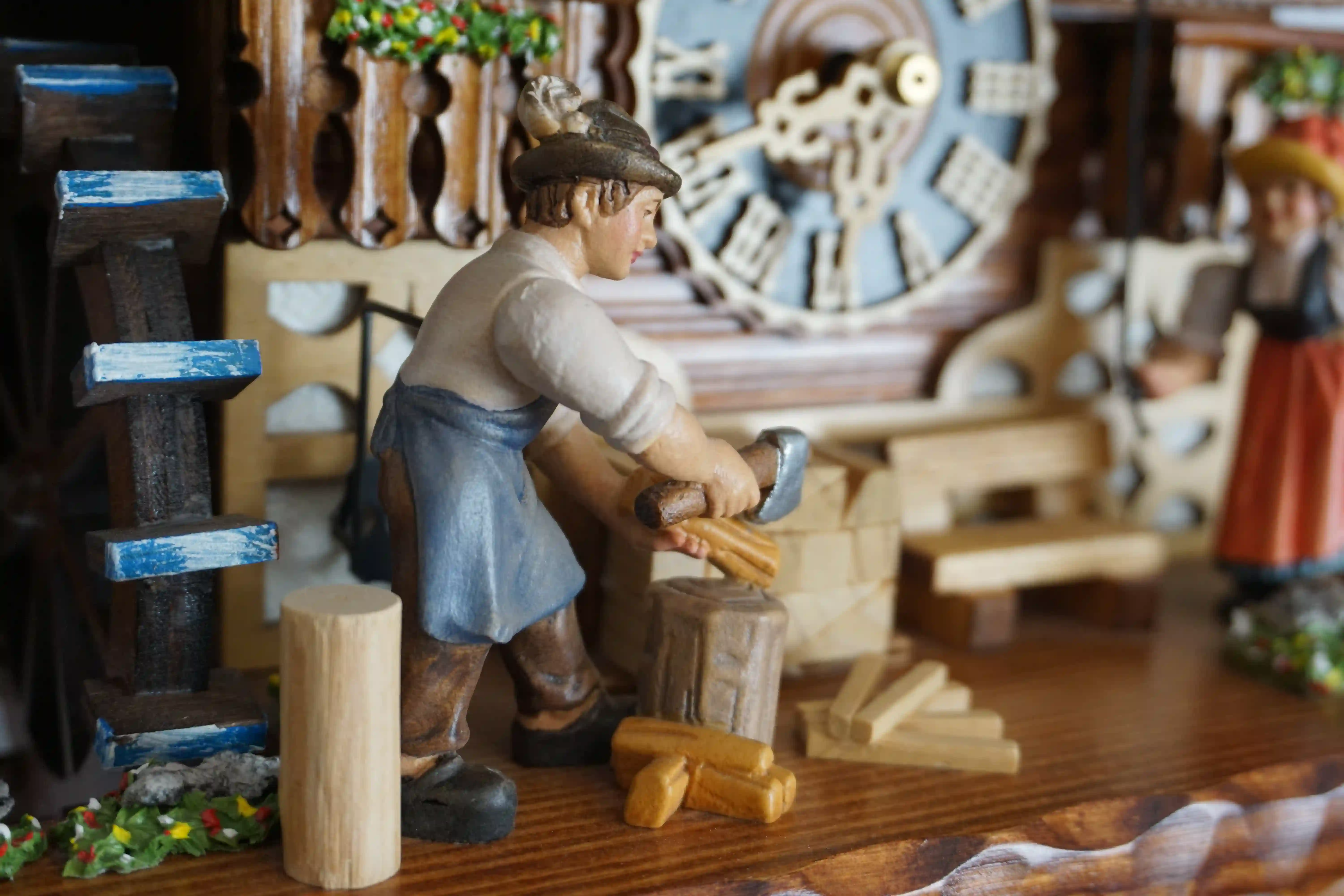 Cuckoo Clock Wood Chopper and Bell Ringer 8 Day Movement with Music (6) This very detailed black forest mechanical 8 day cuckoo clock shows a wood chopper and a bell ringer, both hand-painted and hand-carved figurines. A typical Black Forest house with people wearing traditional Black Forest clothing is a must-have motif of t