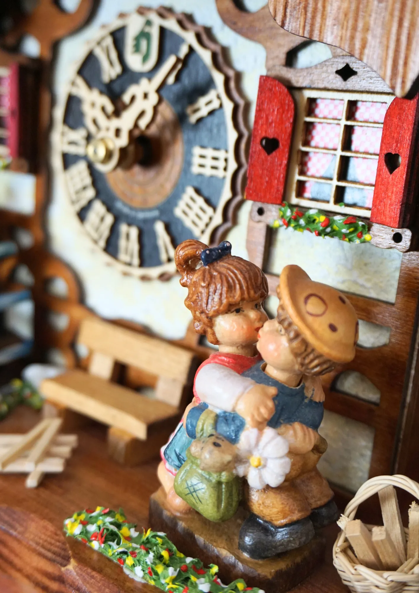 Cuckoo Clock  Kissing Kids  8 Day Movement with Music (3) Chalet shingle roof mechanical black forest cuckoo clock with presice attention to detail. The kids are turning their heads and kissing, water wheel turns and the dancers are dancing as the music is playing
