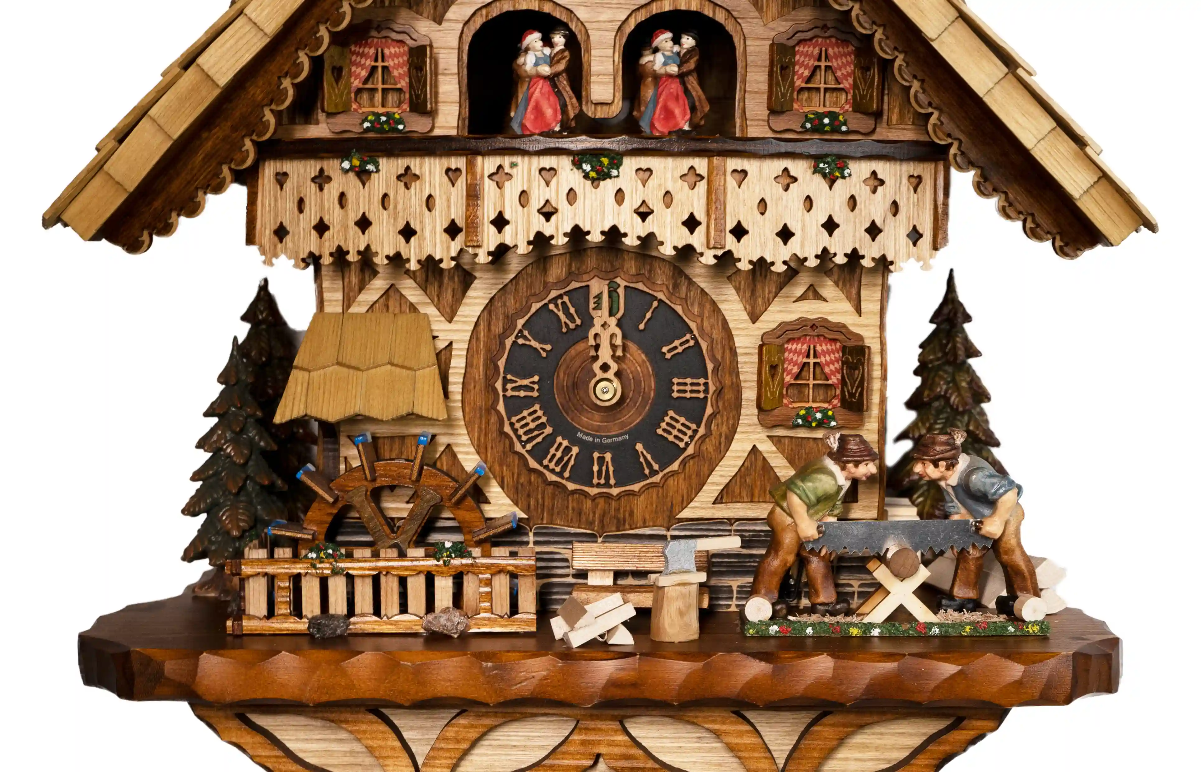Cuckoo Clocks  Wood Sawyers  8 Day Movement with Music (4) Stunning chalet style shingle roof beige mechanical black forest cuckoo clock with music representing the wood works in the area. As the music plays wood sawyers are sawing the wood, water wheel turns and the dancers dance. The clock has automatic night o