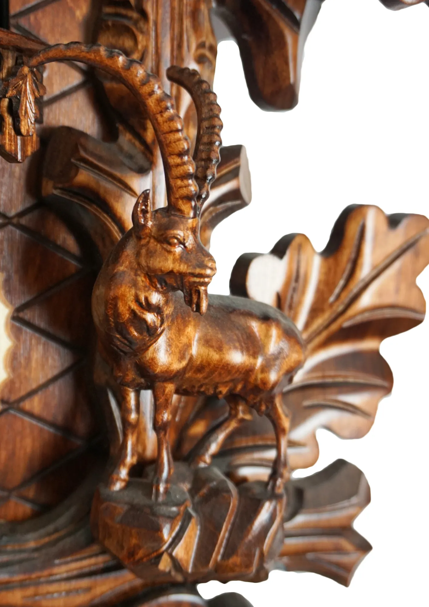 Cuckoo Clock  Black Forest Wildlife  8 Day Movement with Music (4) Large authentic traditional style brown mechanical black forest cuckoo clock precisely hand carved to the finest detail. Representing black forest wildlife with an oak leaves decorating the whole clock, deer overlooking the forest on top, ox and the rock