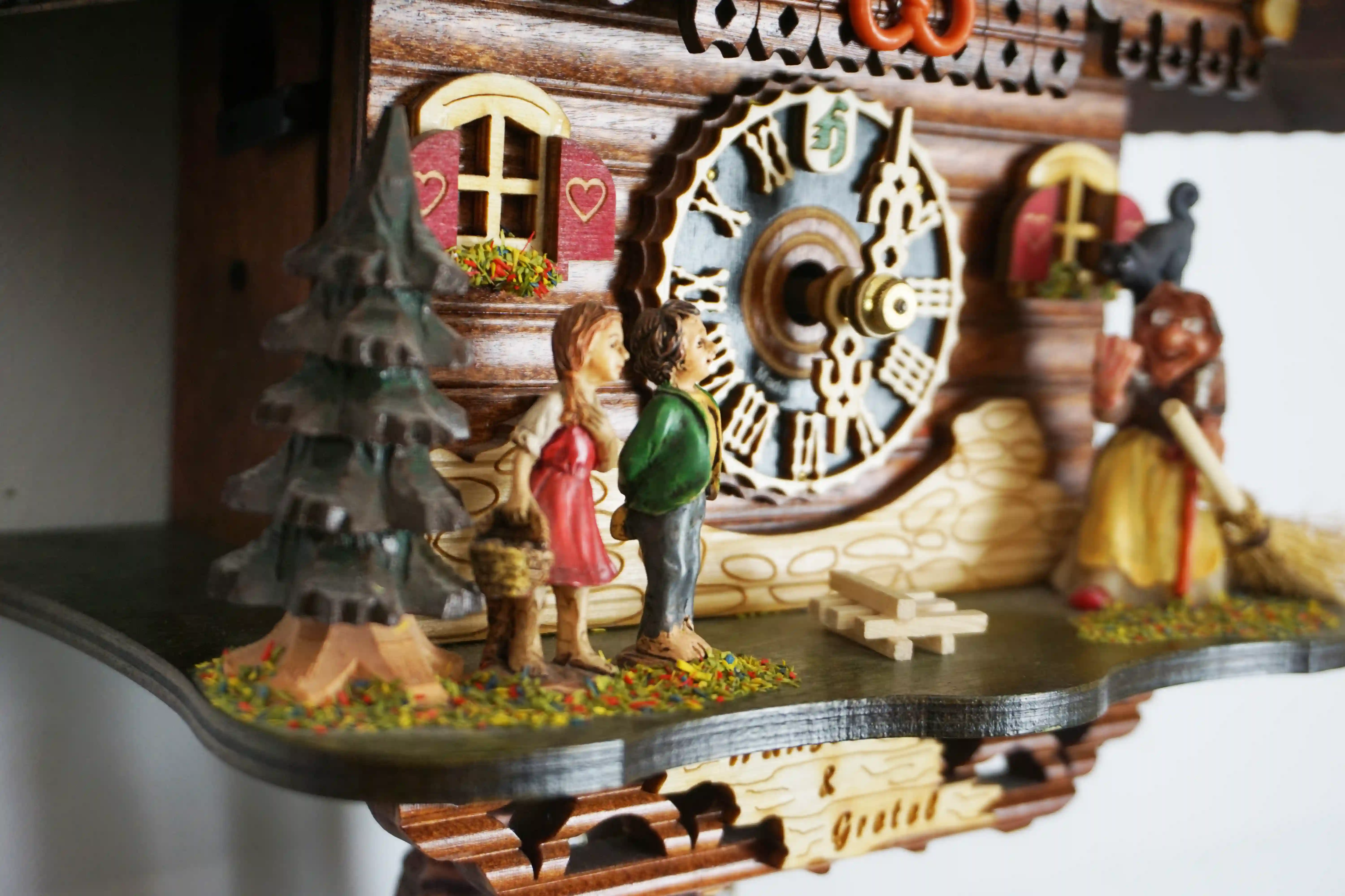 Cuckoo Clock  Hansel and Gretel  1 Day Movement (4) Authentic black forest cuckoo clock representing hansel and gretel story where the witch can be seen in front of the house of sweets made by Hönes