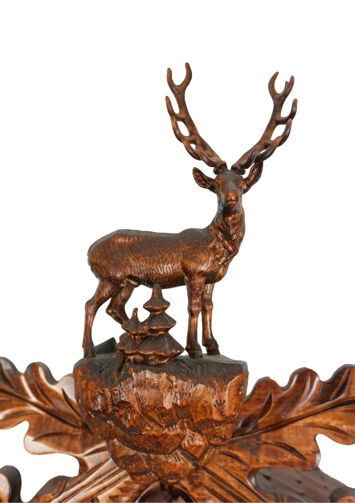 Cuckoo Clock  Black Forest Wildlife  8 Day Movement with Music (3) Large authentic traditional style brown mechanical black forest cuckoo clock precisely hand carved to the finest detail. Representing black forest wildlife with an oak leaves decorating the whole clock, deer overlooking the forest on top, ox and the rock